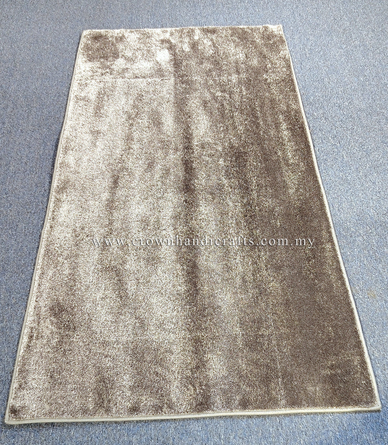 Beige runner rug with speckled sheen and centered distressed pattern, bordered edges