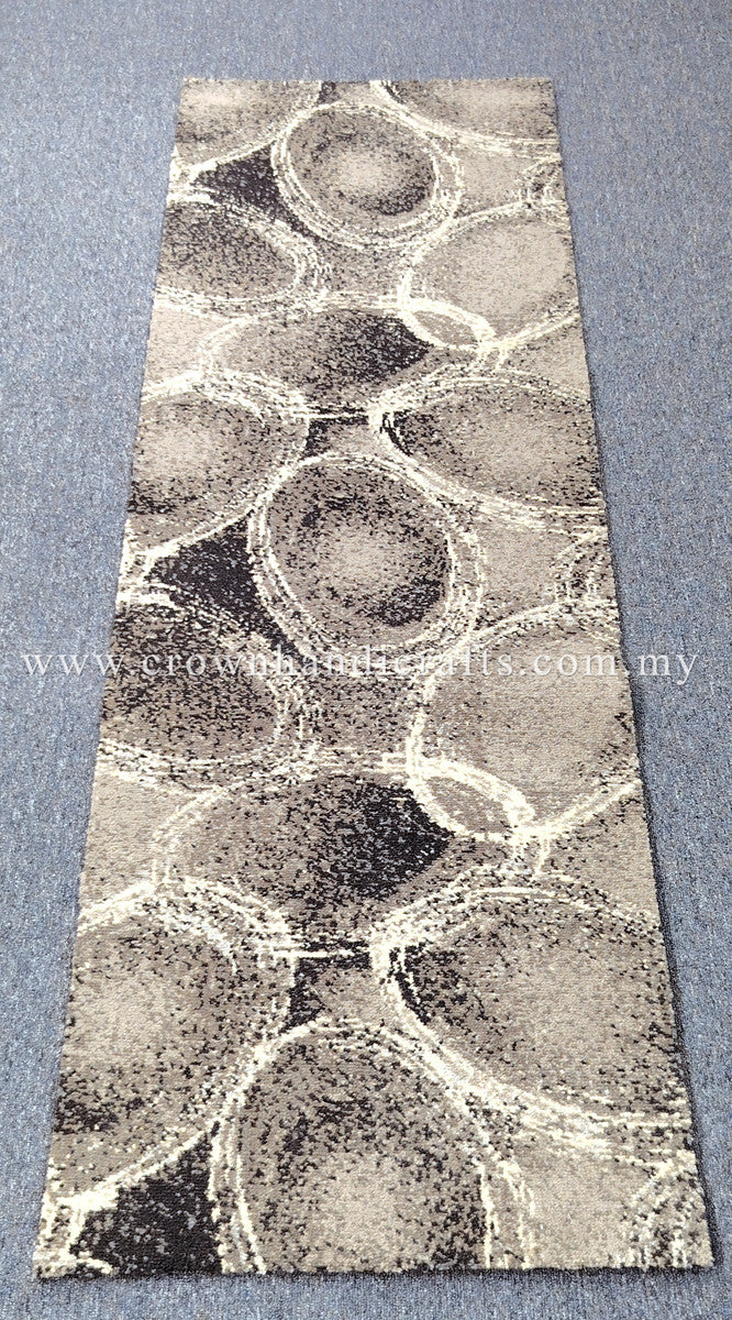 Abstract runner rug with large circular motifs, light beige base and dark speckles