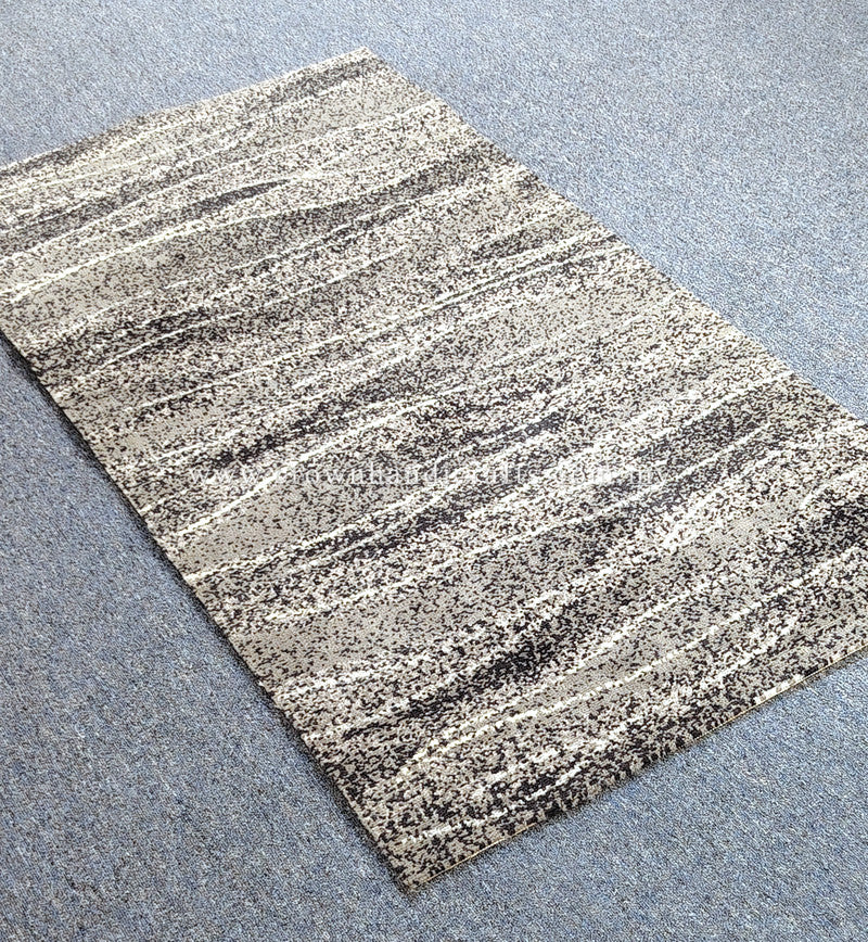Abstract striped area rug, cream base with dark speckled horizontal bands