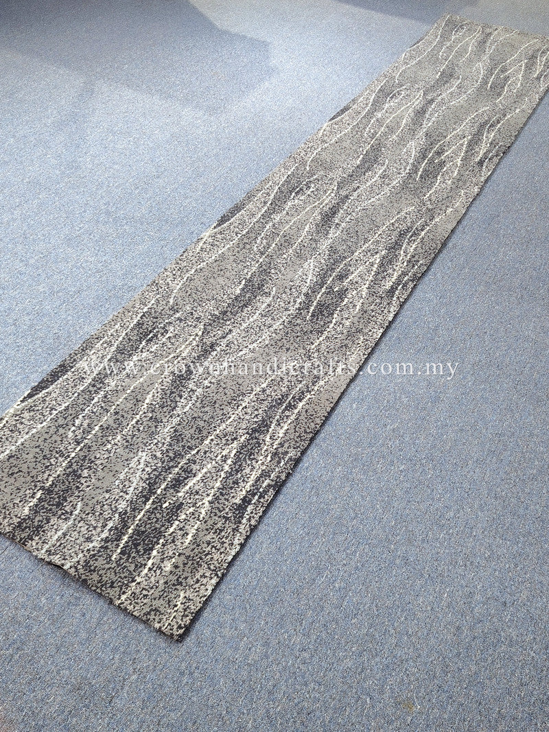 Extra-long abstract runner rug laid diagonally, gray and cream wavy line pattern