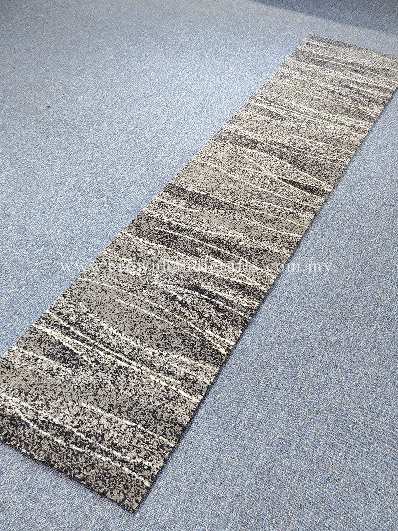 Slim abstract runner rug with layered stripe pattern in speckled light and dark gray
