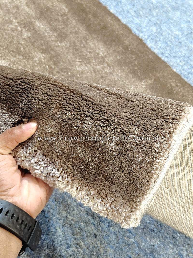 Natural brown runner rug close-up of plush pile and stitched border