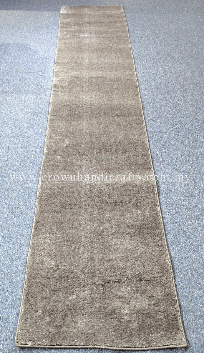 Hallway runner rug in beige with low-pile texture and darker shaded ends