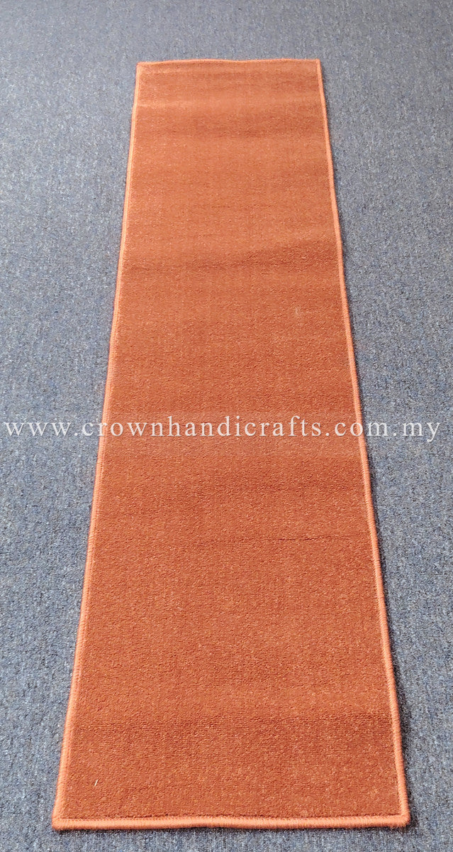 Rust velvet runner rug, long narrow design with consistent plush pile