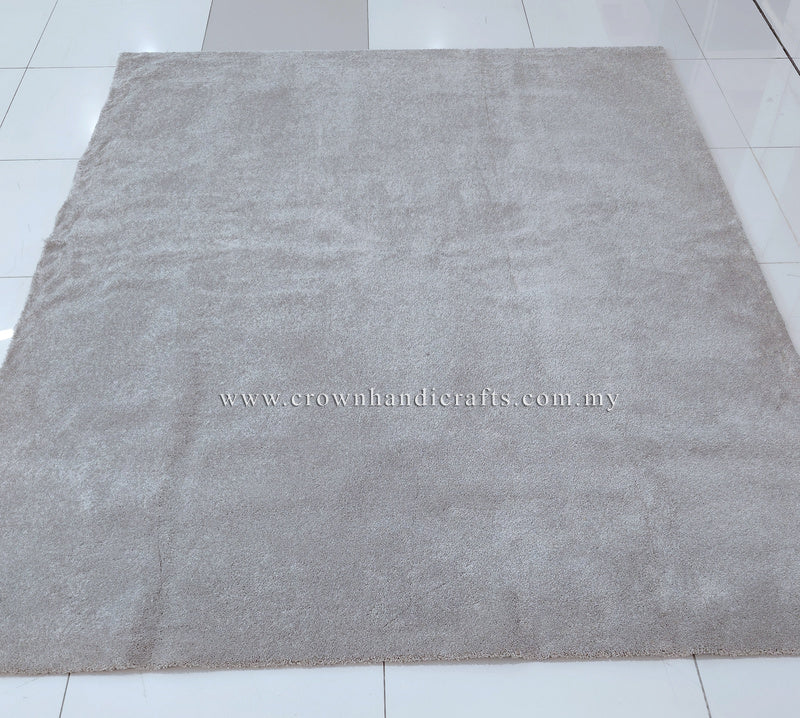Plush square or rectangular area rug with short dense pile in light gray-beige