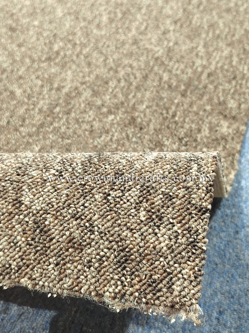 Rectangular textured rug corner close-up, dense loop pile and short frayed binding