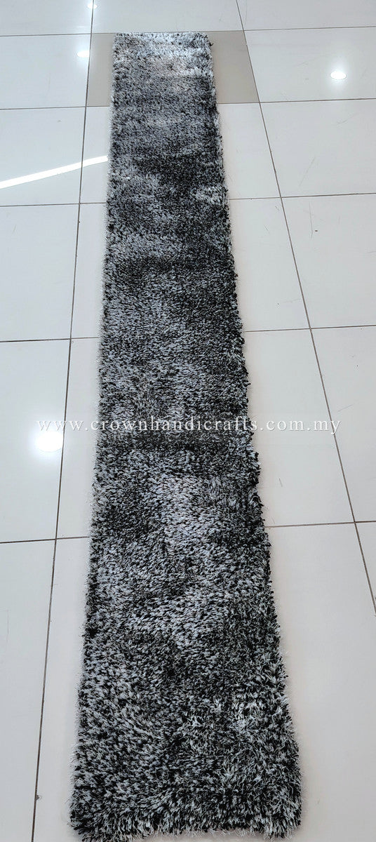 Monochrome shag runner rug, long narrow rug with dense black-and-white pile.