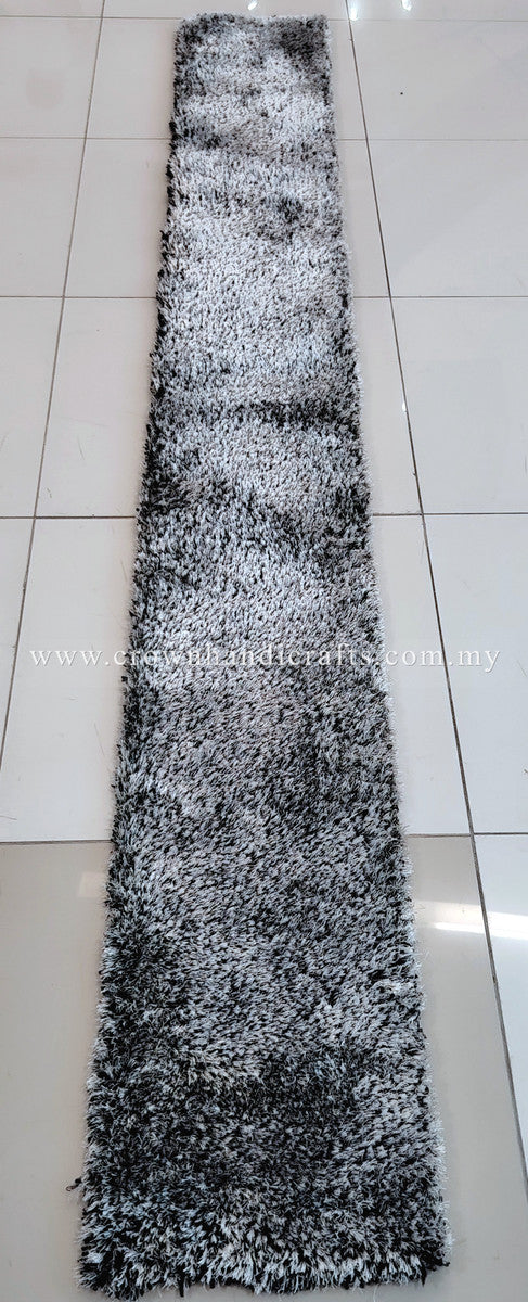 Long shag runner rug in black-and-white tones, textured high-pile surface.