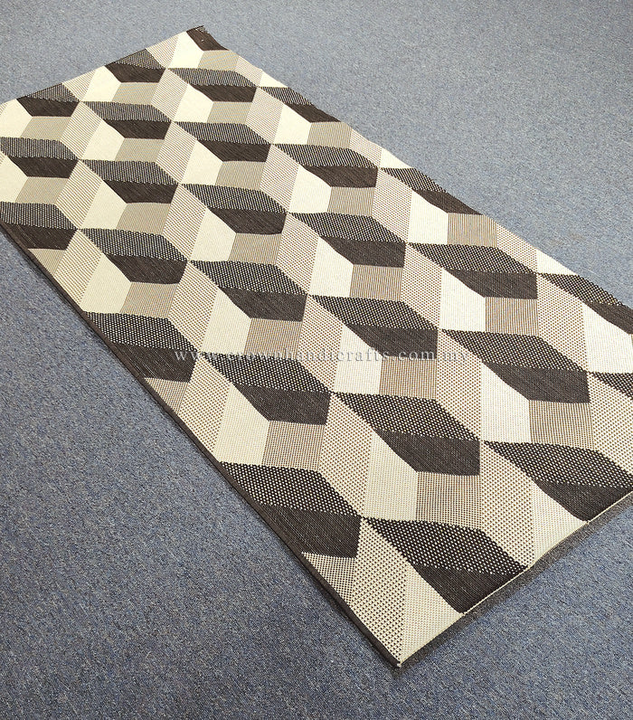 Rectangular runner rug with repeating cube squares in cream and dark brown