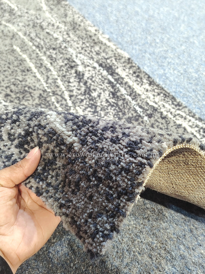 Abstract runner rug with dark blue-gray texture and frayed jute-like border edge