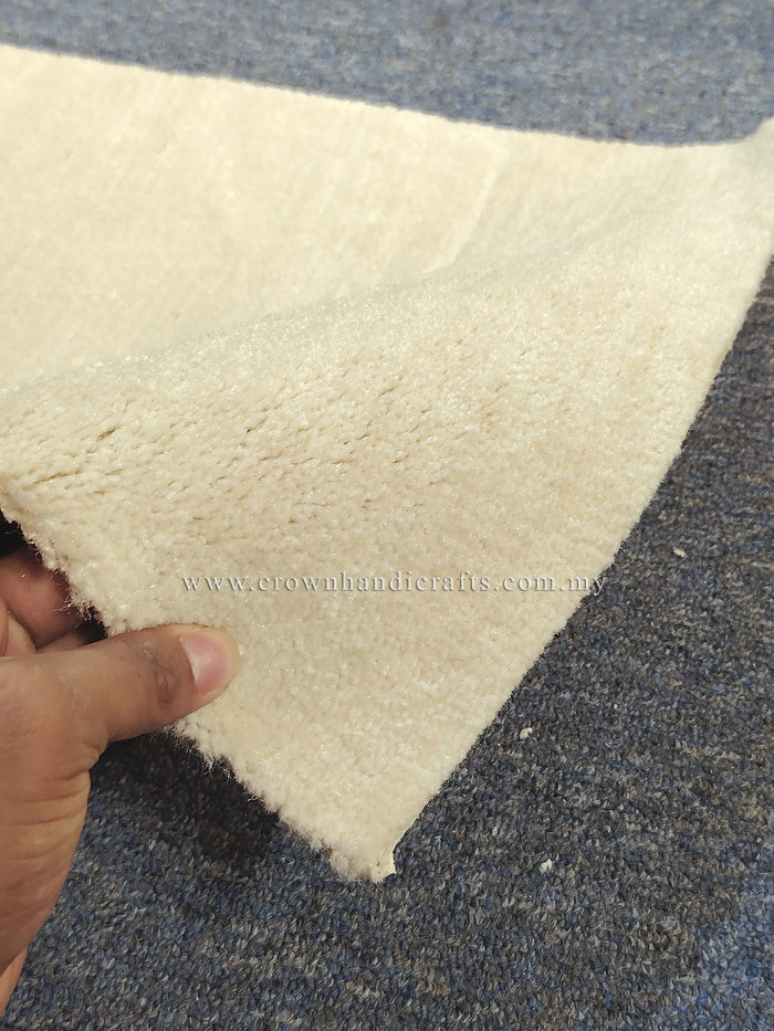 Beige runner rug close-up with plush shag pile texture
