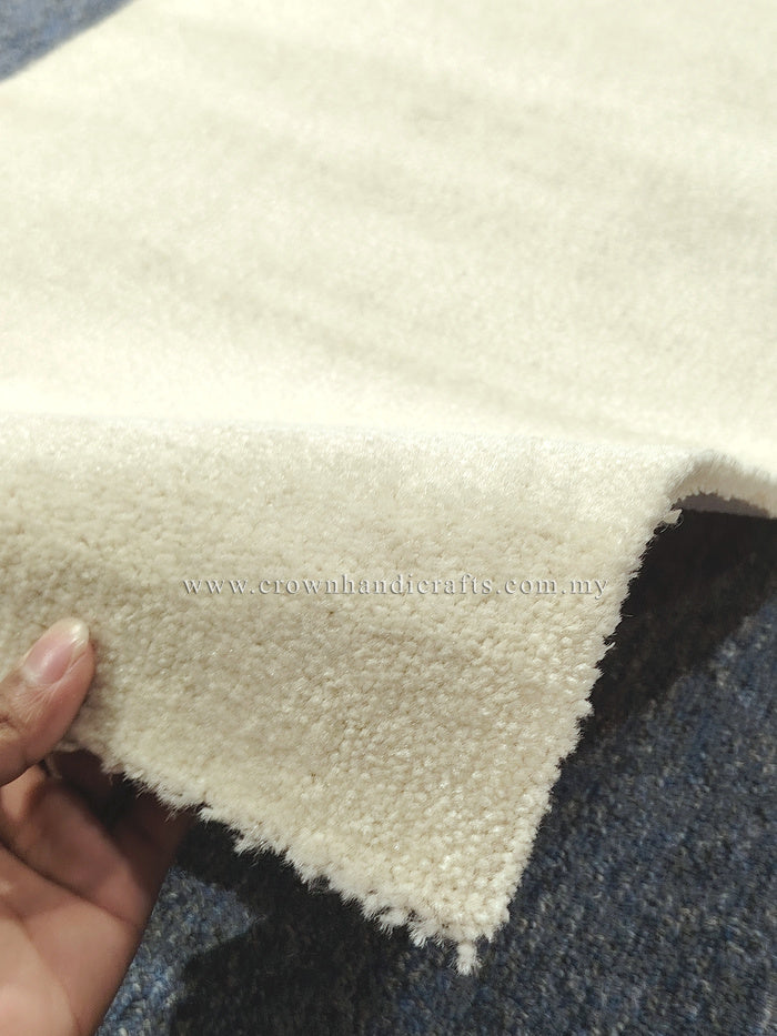 Beige runner rug corner with soft shag texture and short fringe