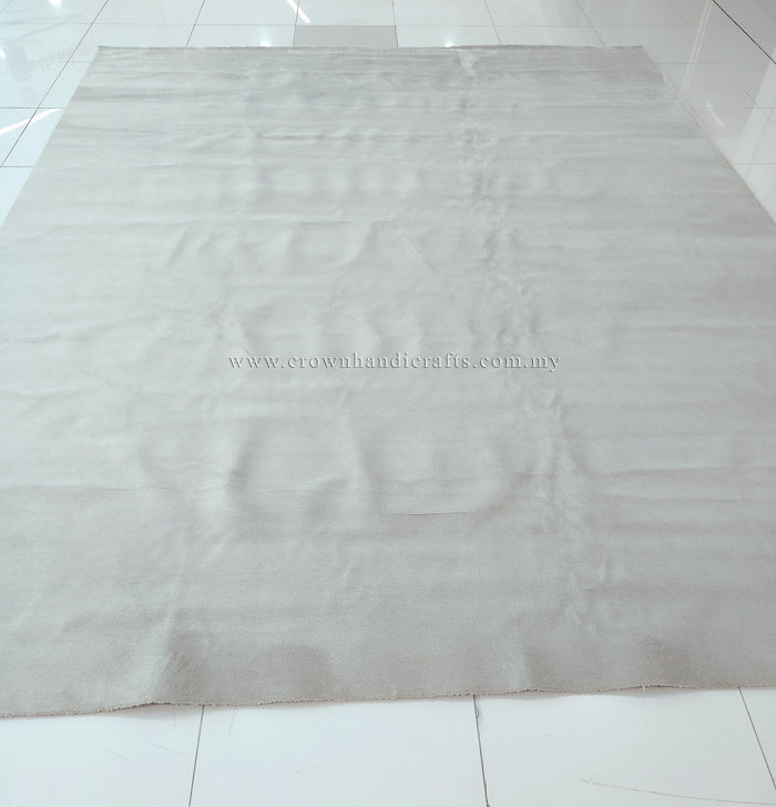 Large oatmeal-beige area rug with mottled soft pile texture