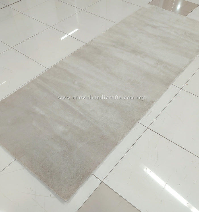 Oatmeal beige runner-style area rug with smooth low-pile surface and clean hem