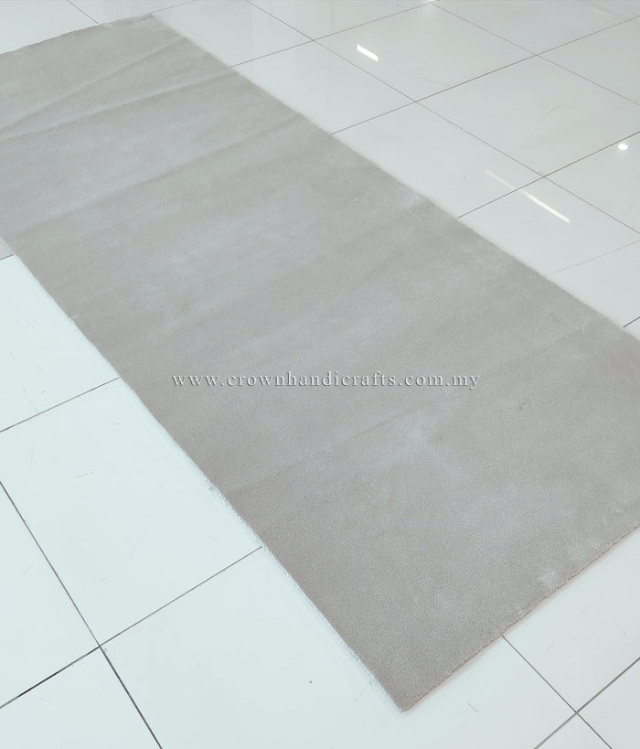 Oatmeal beige long area rug with subtle tonal pattern and uniform low pile