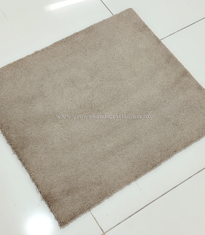 Soft shaggy accent rug with dense short pile, taupe brown square, diagonal angle