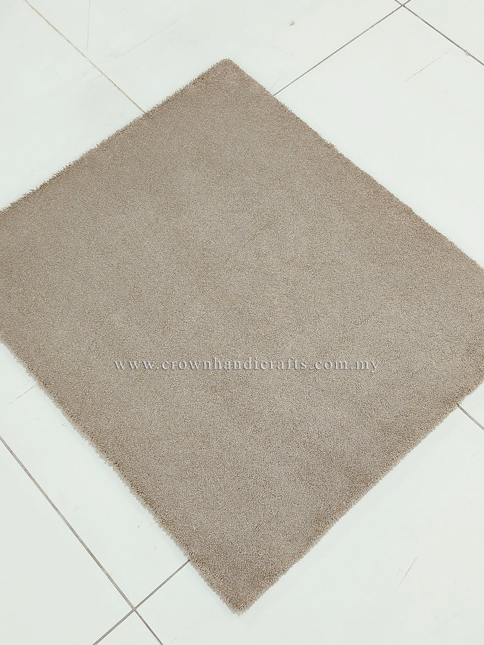 Soft shaggy accent rug with dense short pile, taupe brown square on tile floor