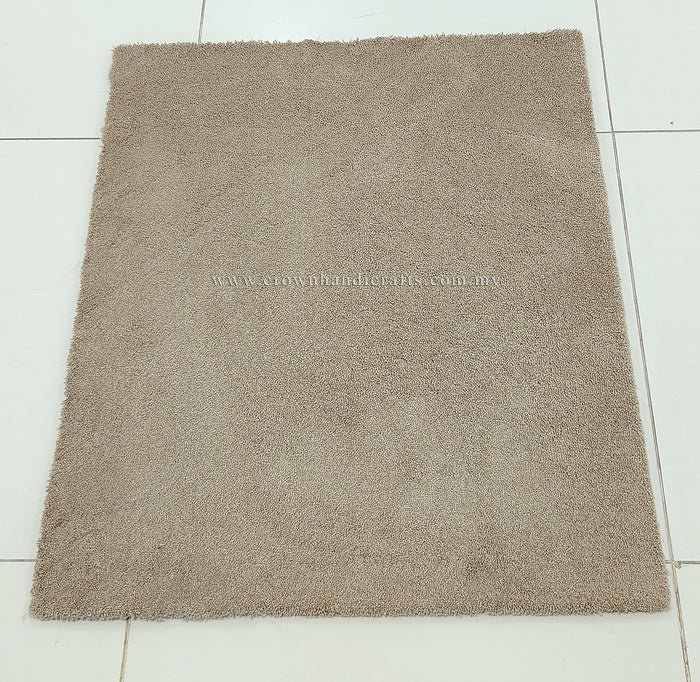 Rectangular shaggy rug, light brown, full flat view with short dense pile.