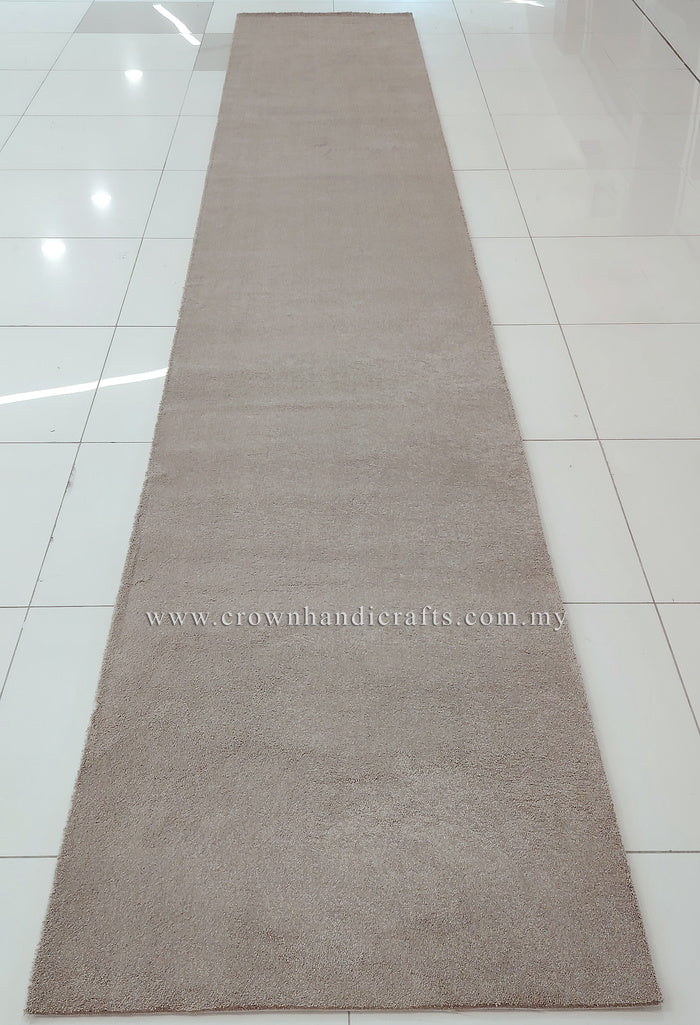Taupe long shaggy runner rug, full length view on smooth tile