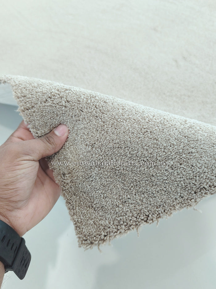 Taupe shaggy runner rug close-up showing dense short pile and trimmed side edge