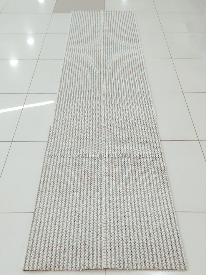 Natural-tone woven runner carpet with dense grid weave and uniform texture