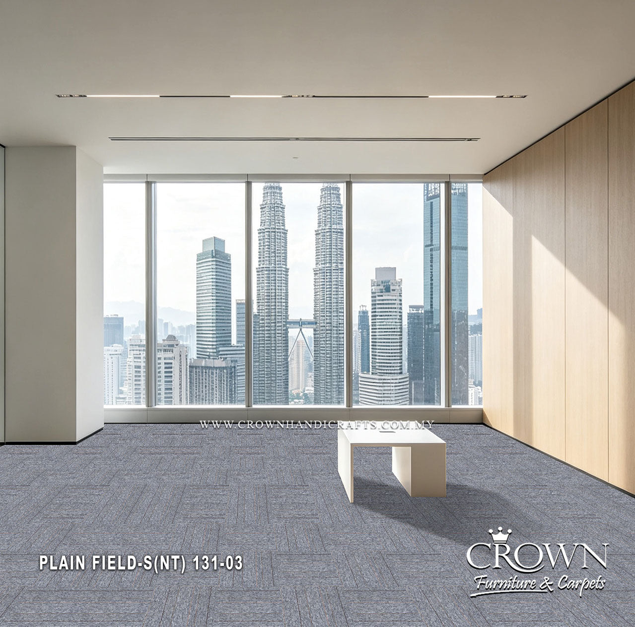 Medium gray textured carpet tiles in a bright office, modular field layout.