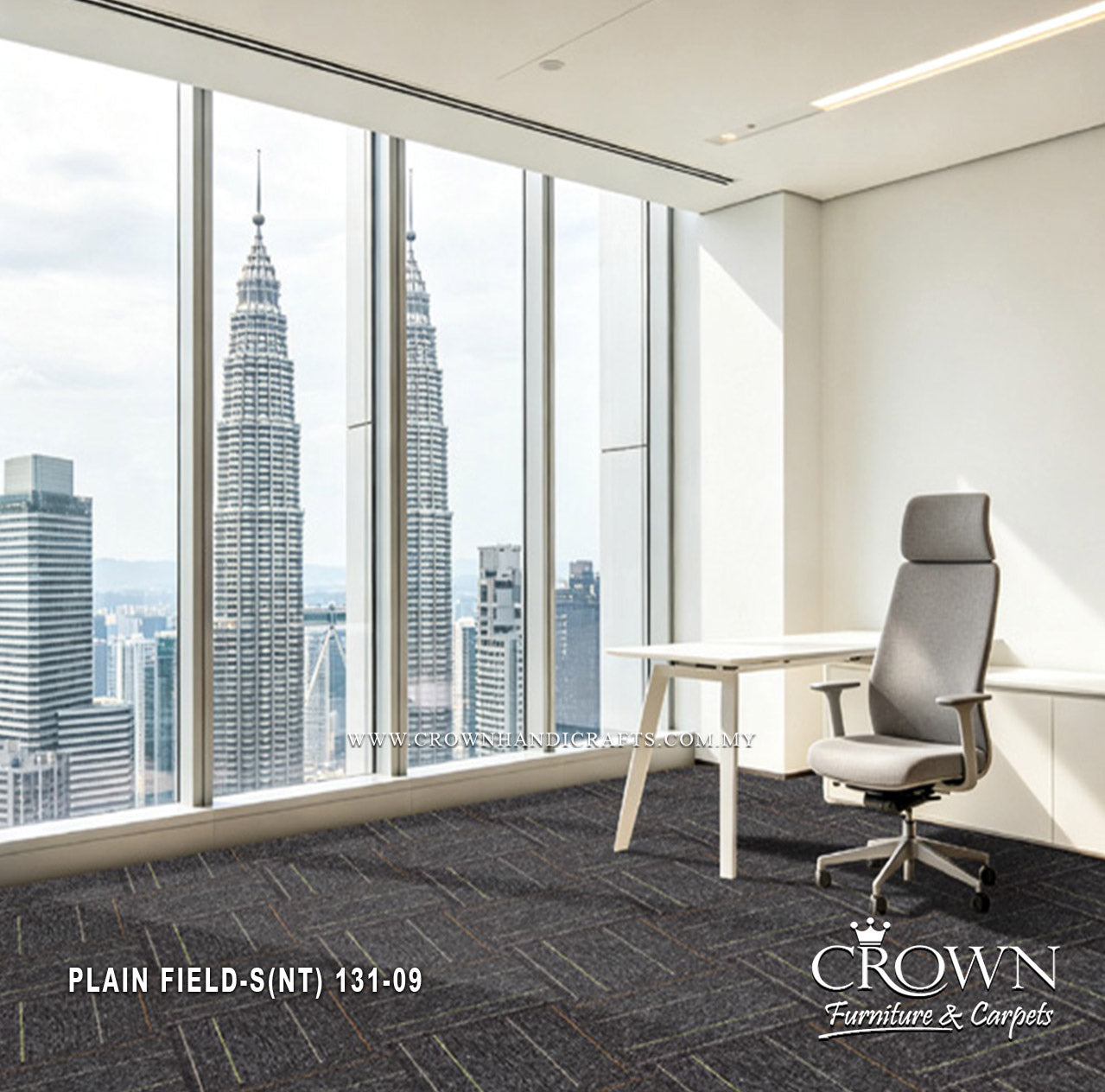 Charcoal textured carpet tiles in a minimalist office, modular field pattern.