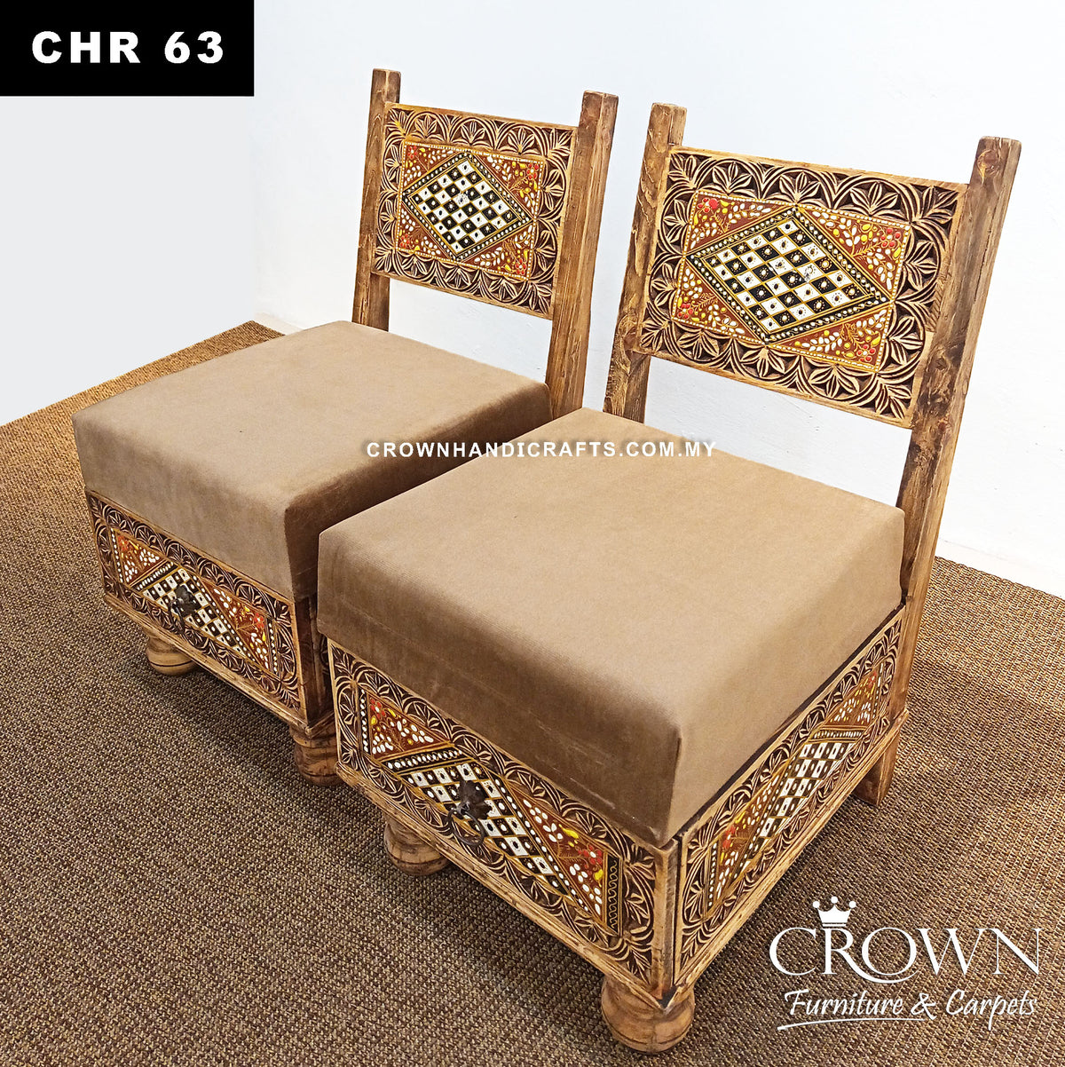 Low wooden chair with beige padded cushion and carved geometric Rajasthani front panel