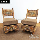 Pair of low wooden chairs facing forward, beige seat cushions, ornate geometric inlays