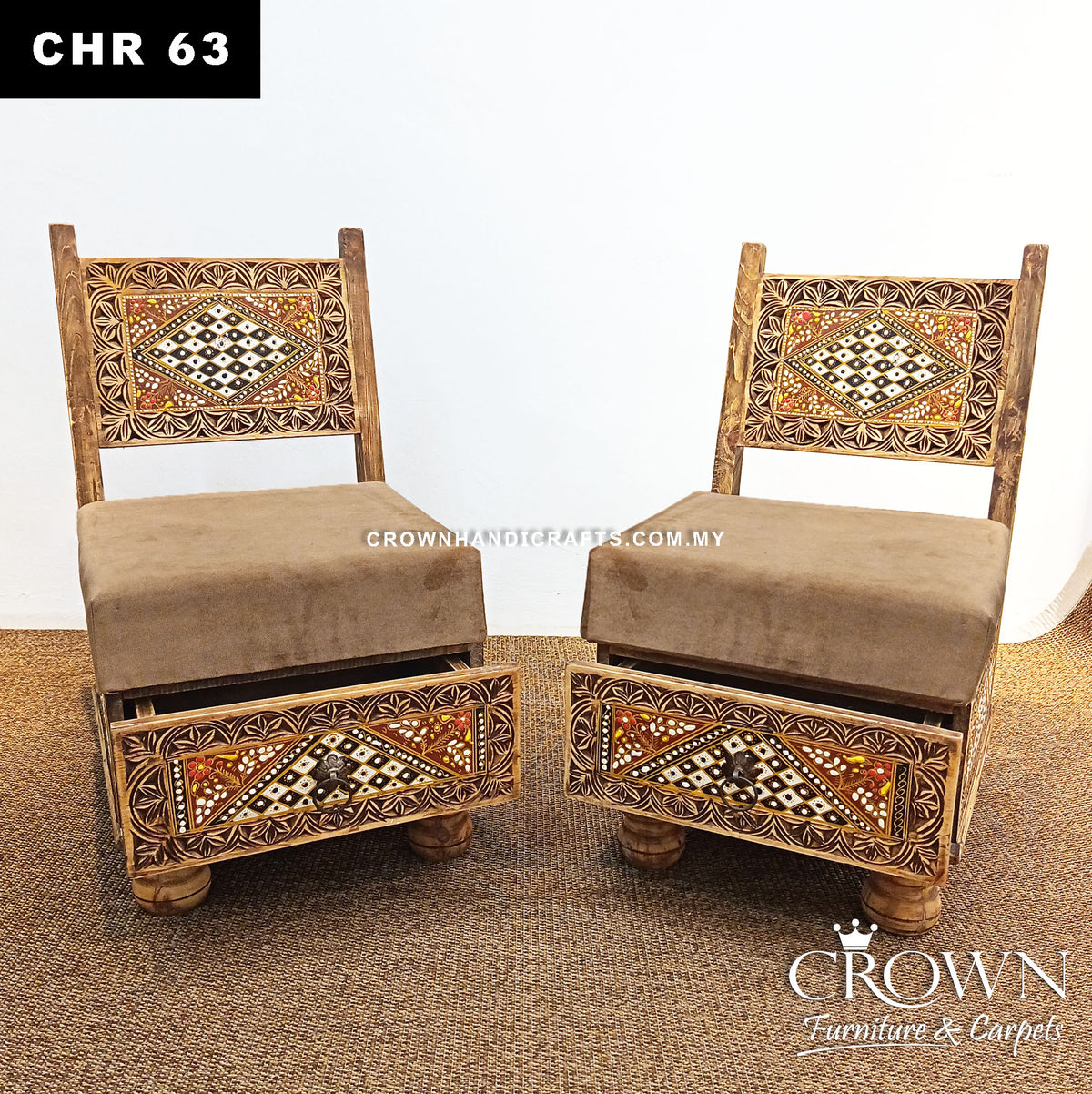 Pair of low wooden chairs facing forward, beige seat cushions, ornate geometric inlays