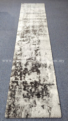 Beige runner rug with large dark mottled abstract motif, short plush pile