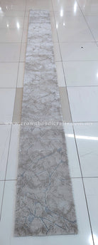 Extra-long beige textured carpet runner with subtle abstract pattern along the length