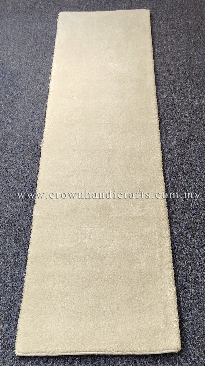 Cream runner rug, slim narrow rectangle with soft plush surface and bound hem.