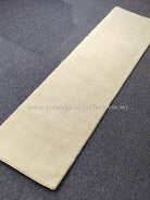 Cream runner rug with smooth low pile and flat woven look across center.