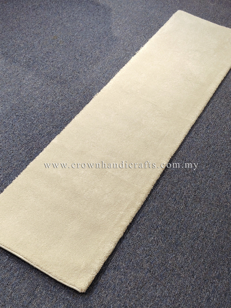 Cream runner rug with smooth low pile and flat woven look across center.
