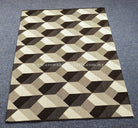 Geometric area rug with interlocking cubes pattern in black, white and beige.