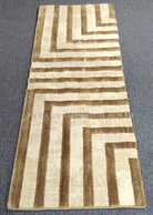 Beige hallway runner rug with cream field and brown linear geometric pattern