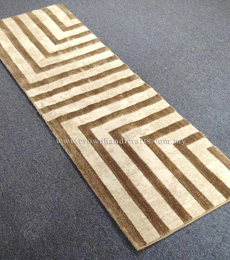 Beige hallway runner rug featuring brown and cream chevron stripe design
