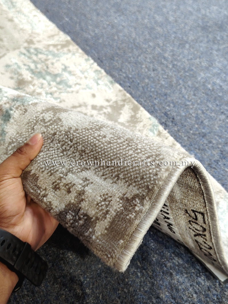 Beige runner rug corner detail with teal distressed motif and short pile texture