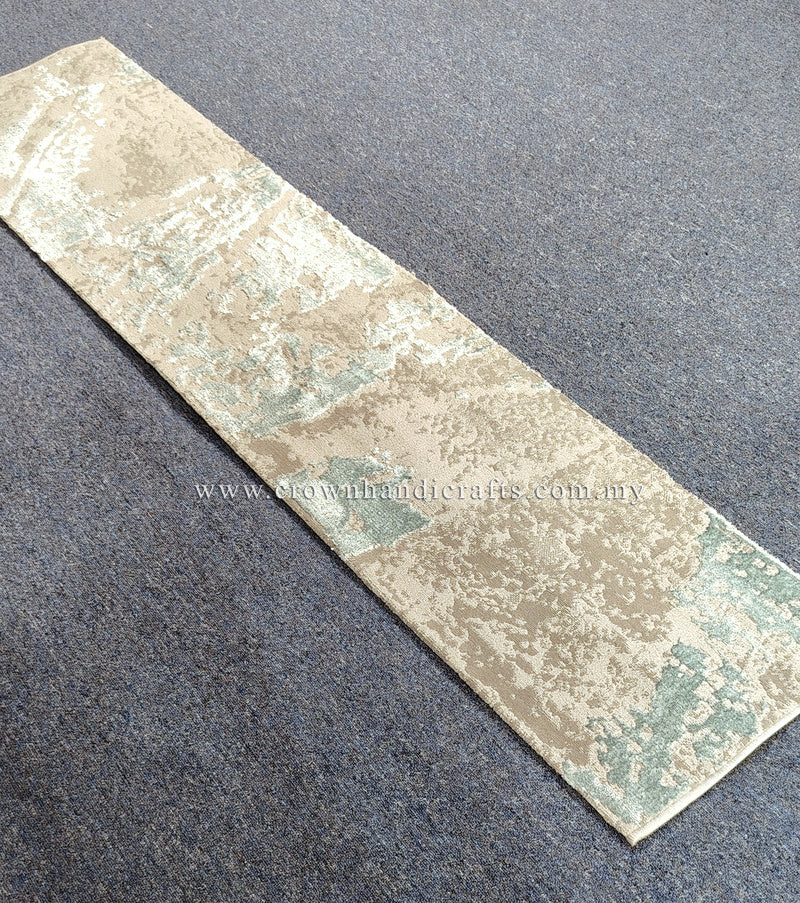 Slim runner rug laid flat, cream base with light blue abstract pattern