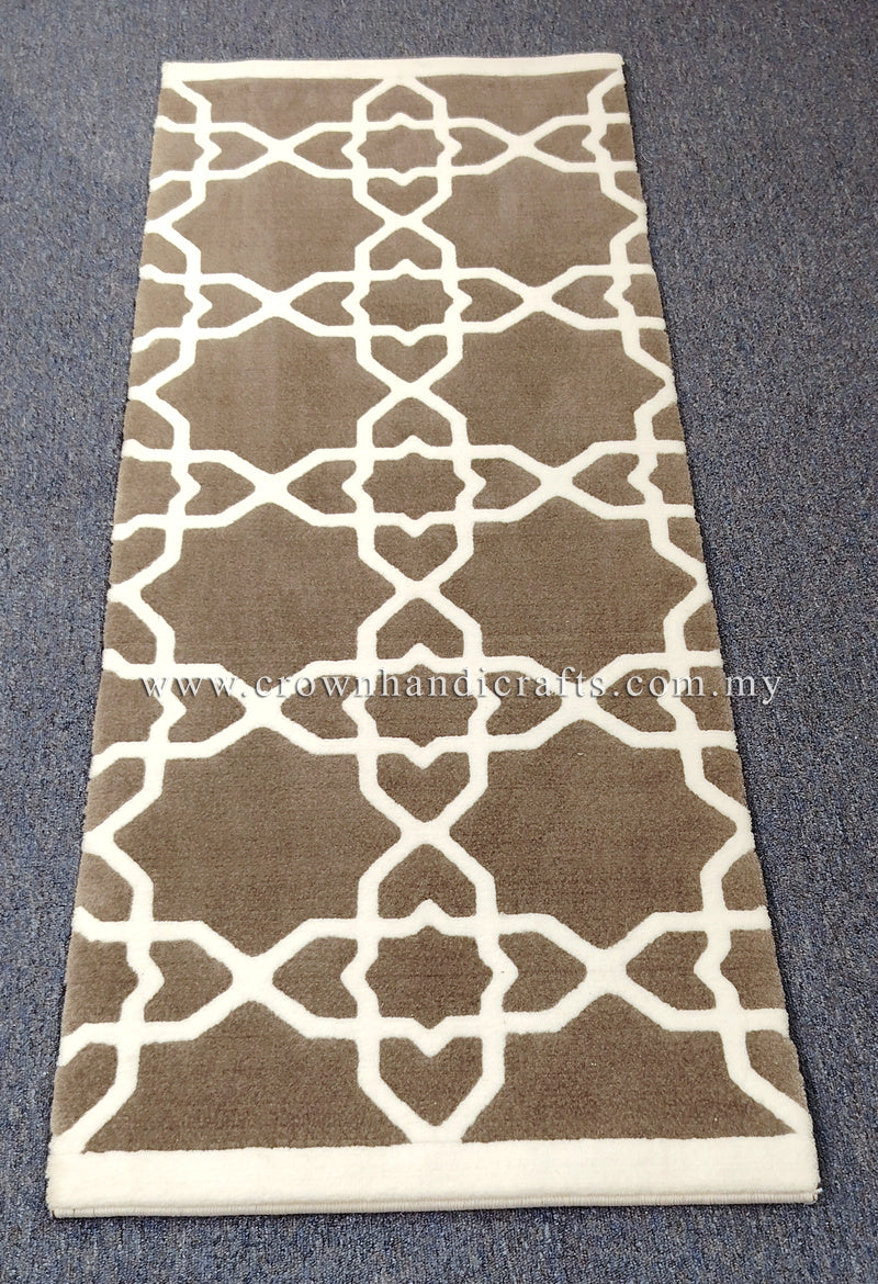 Slim runner rug with repeating white lattice motifs on grey-brown center and cream border.
