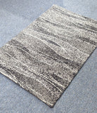 Abstract area rug, cream-and-charcoal horizontal stripes with speckled texture