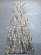 Extra-long abstract runner rug with wavy vertical lines in gray and cream