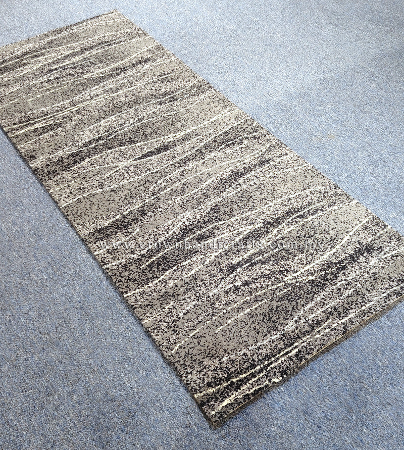 Abstract runner rug with beige and dark speckled horizontal stripe texture, corner view