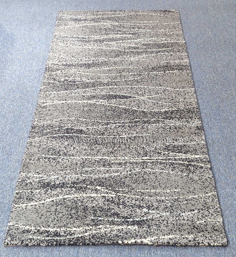 Runner rug with abstract stripe pattern in cream and dark gray, flat lay view