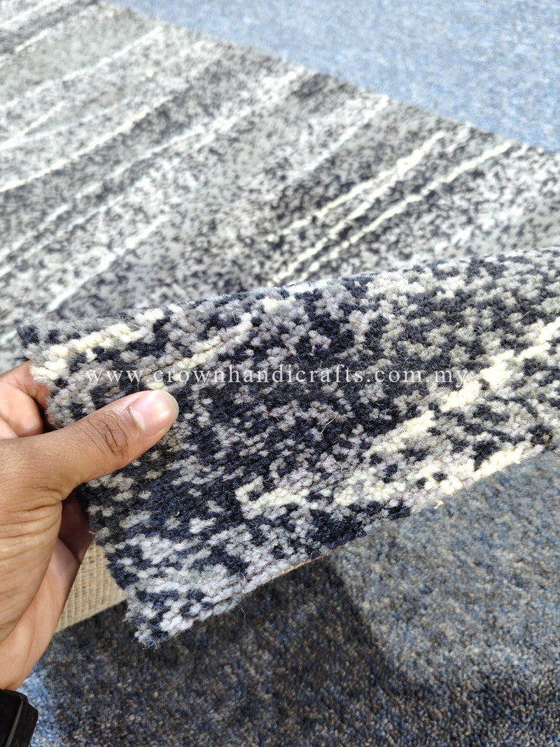 Runner rug: dark blue, light speckled abstract horizontal bands, close-up edge.