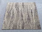 Square abstract area rug with beige and white vertical speckled stripes, flat view