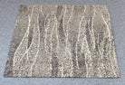 Square abstract rug with beige base, vertical dotted streaks and textured bands