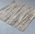 Square abstract area rug with beige base, speckled stripes and line details
