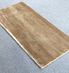 Natural brown hallway runner rug with low textured pile and edge binding